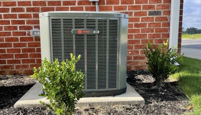 Air Conditioner By Brick Wall