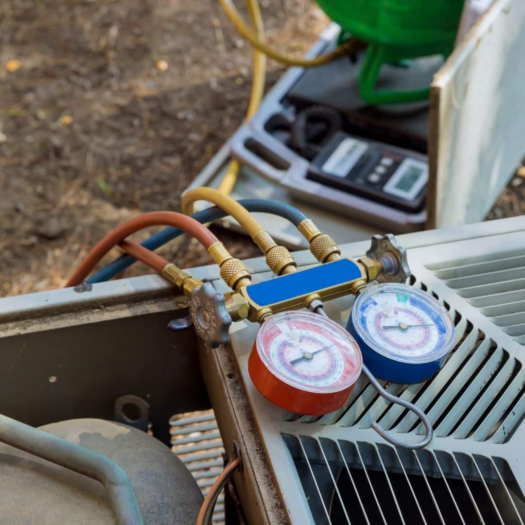 Outdoor HVAC unit being repaired